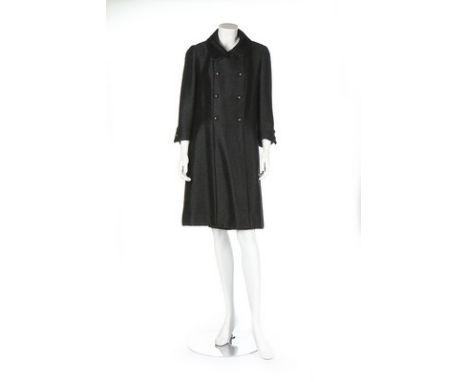 A Chanel couture black mohair coat, circa 1963, narrow woven brown on tan label, no 19495, A-line, double breasted the fabric