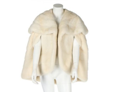 A white mink capelet, probably 1980s, un-labelled with monogram 'JC' to silk lining, with large shawl collar and arm slits   