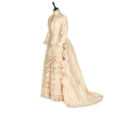 A group of Victorian clothing, comprising: remains of a silk damask bridal gown c.1850; a damp speckled white cotton bridal g