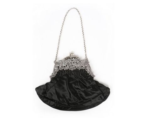 A general group of purses, 1800s-1880s, including one with ornate metal frame depicting gargoyles and serpents; another finel