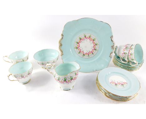 A Paragon porcelain tea service, decorated with flowers against a turquoise ground, pattern no. G5951., printed and painted m