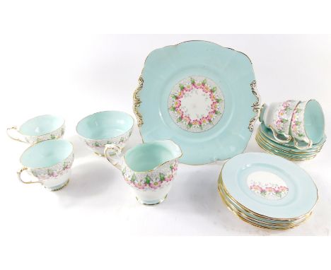 A Paragon porcelain tea service, decorated with flowers against a turquoise ground, pattern no. G5951., printed and painted m