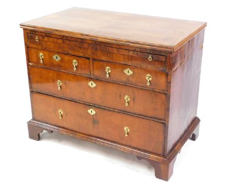 A William &amp; Mary and later walnut bachelor's chest, of two short over two long drawers, with brushing slide and feathered