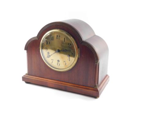 An Edwardian mahogany cased mantel clock, the circular brass dial bearing Arabic numerals, Continental movement with Westmins