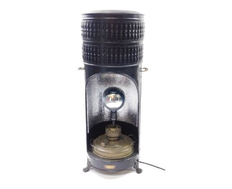 An Ardent Belgian early 20thC black tin and brass paraffin heater, converted to an electric floor lamp, of cylindrical form, 