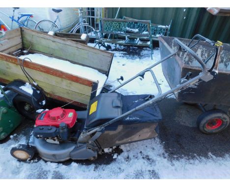 A Honda HRD536 petrol lawnmower, with three speed and self propelled rear roller.