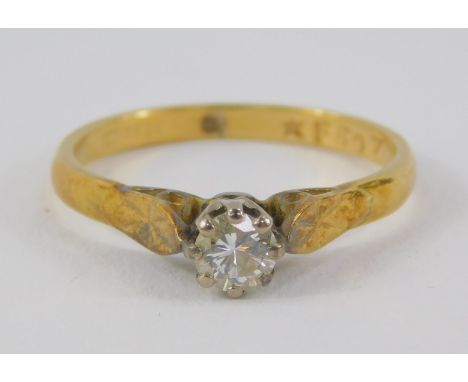 An 18ct gold and diamond solitaire ring, high claw set, approx 1/4ct, size K, 2.1g,