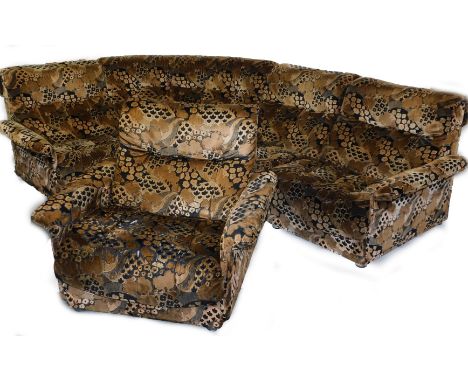 A 1970's vintage modular lounge suite, upholstered in funky brown floral fabric, comprising a three section sofa, corner seat