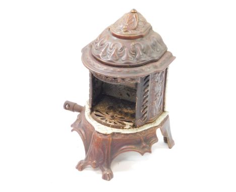 A Welsbach Kern portable cast iron and enamel gas radiator, c1900, with leaf moulded decoration.