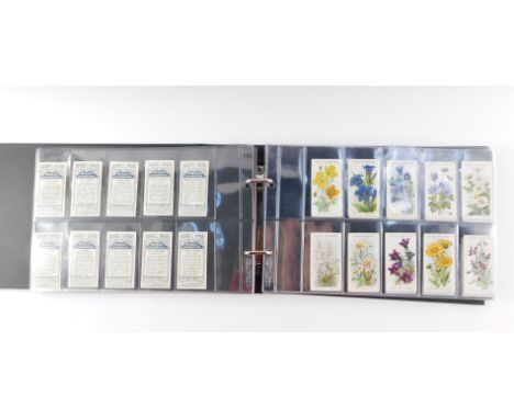 Cigarette cards, comprising six full sets; Wills's Russian Architecture., Alpine Flowers., Flags of the Empire, first and sec
