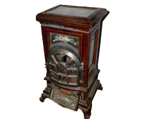 A French early 20thC cast iron and enamel wood burner, by A Martin Revin, No 4, 1920., of rectangular form, decorated with pa