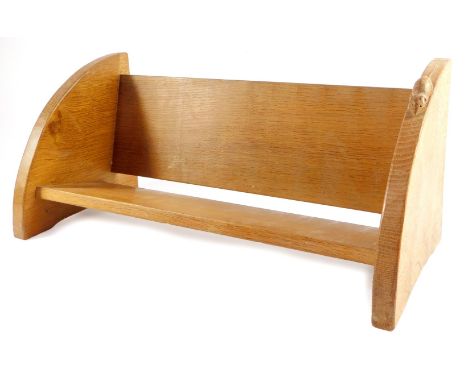 A Mouseman light oak book trough by Robert Thompson of Kilburn, with quartered end panels, one carved with a mouse, 45.5cm wi