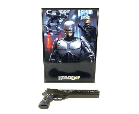 Robocop (1987) plastic gun in framed display, hand signed in silver by Peter Weller "ROBO Your Move Creep! Dr Peter Weller", 