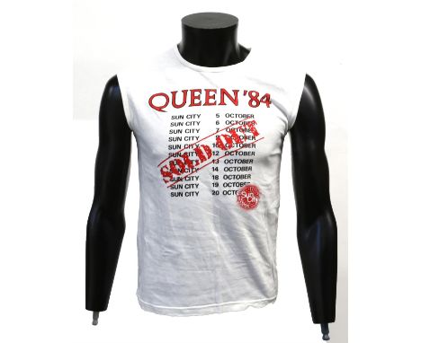 Queen - Crew sleeveless T shirt from Sun City 1984 given to Peter Hince, showing dates with 'SOLD OUT' stamped over, unworn, 