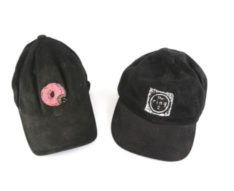 A pair of crew hats from The Ring Two (2005) and The Simpsons Movie (2007). 