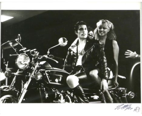 Queen - Original 10 x 8 inch Black and white silver gelatin print showing Freddie Mercury on a motorbike with a dancer on the