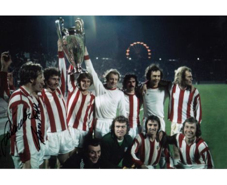 Autographed BAYERN MUNICH 12 x 8 photo Col, depicting players celebrating with the European Cup in front of photographers fol