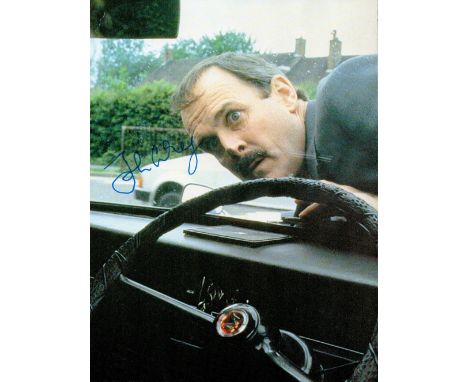John Cleese, a signed 8x6 Clockwise film photo, with Cleese playing the part of headmaster Brian Stimpson. Good condition. Al