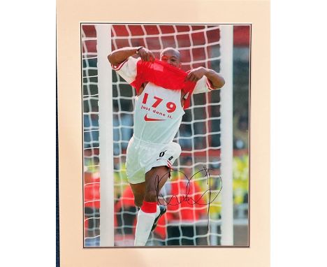 Ian Wright signed 19x15 mounted colour photo pictured during his playing days with Arsenal. Good condition. All autographs co