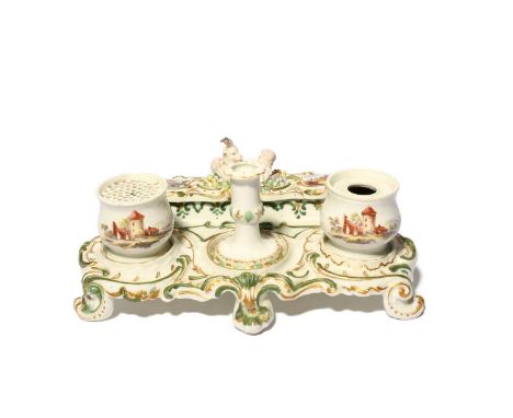 A rare Derby desk set or inkstand, c.1758-60, the rococo scrolled stand set with an integral penholder surmounted with two pu