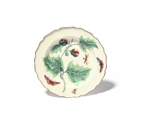A Chelsea Hans Sloane plate, c.1758-60, painted with a large botanical specimen of a fruiting branch with moths and other ins