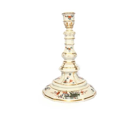 A Meissen candlestick, c.1735-37, of moulded knopped form, painted in Kakiemon enamels with banded hedges before flowering pr