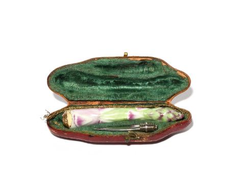 A rare Meissen porcelain quill knife, mid 18th century, modelled as a stem of asparagus, with gilt metal mounts, with a small