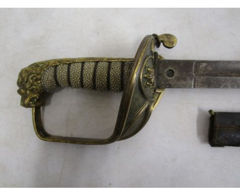 A Naval sword (scabbard is either not original to the sword or has been damages as too small)