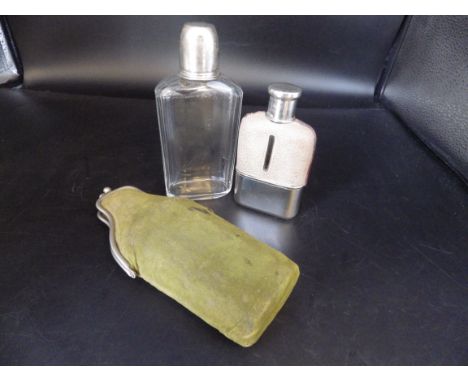 A silver plated hip flask early 1900's stamped 'foreign' and a hunting flask in a suede purse, faceted glass bottle with tigh