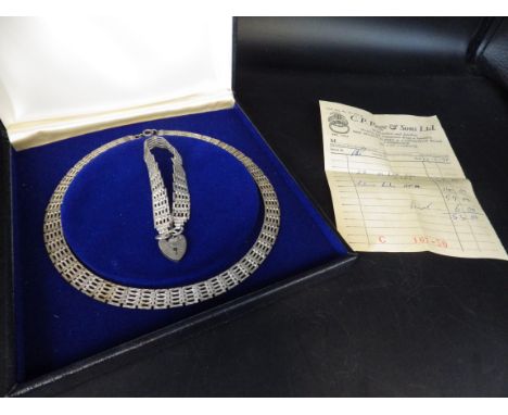 A boxed silver necklace and gate bracelet - hallmarked London 1978 with original receipt 40g total weight