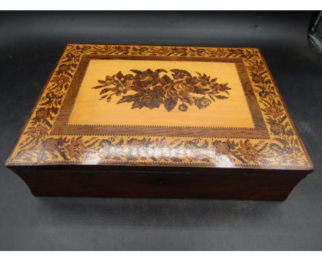 A Tunbridge ware rosewood writing box, of rectangular form, a hinged lid inset with a mosaic flower spray within a broad bord