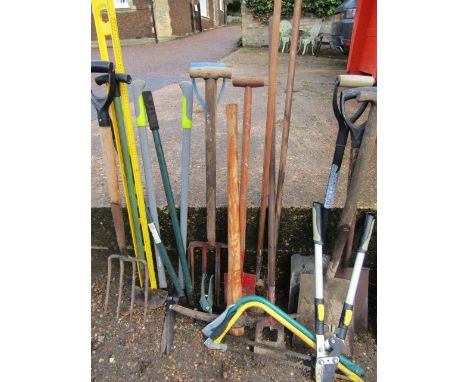 A quantity of garden tools inc pick axe, shovels, forks, bow saws, sheares etc etc