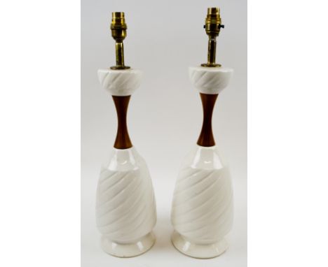 TABLE LAMPS, a pair, mid 20th Century white ceramic with wood necks, 54cm H x 16cm D. 