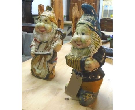 GARDEN GNOMES, two, mid 20th century painted pottery, each playing a musical instrument, 50cm H. (2) (with faults)