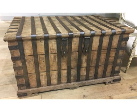 TRUNK, early 20th century vintage Anglo-Colonial teak and iron bound with rising lid and carrying handles, 60cm H x 137cm W x
