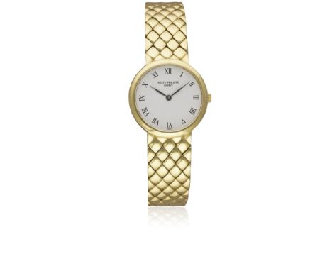 A FINE LADIES 18K SOLID GOLD PATEK PHILIPPE CALATRAVA BRACELET WATCHCIRCA 1990s, REF. 4821/1 WITH PORCELAIN DIAL, ACCOMPANIED