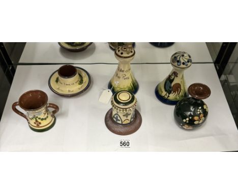 A mixed lot of Torquay motto ware including hat pin stands.