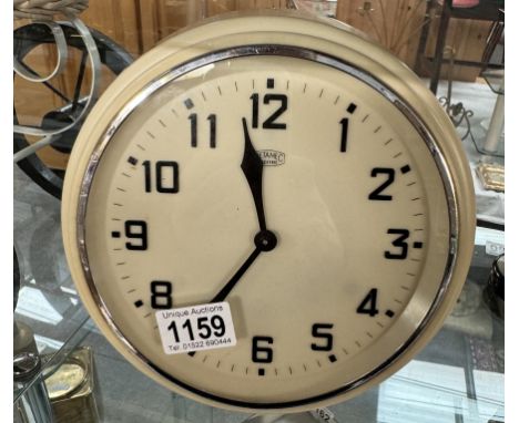 A vintage electric Metamec wall clock