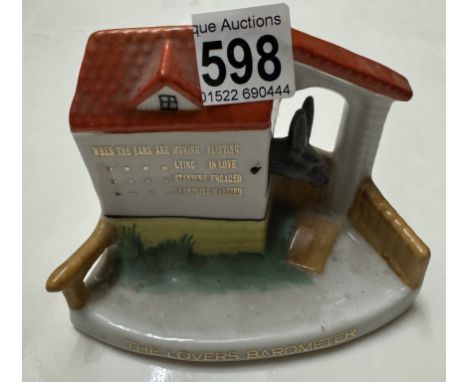 A vintage foreign ceramic, the lovers barometer nodding donkey