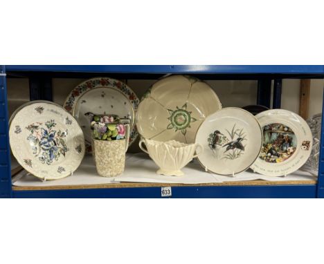 A shelf of vintage decorative plates
