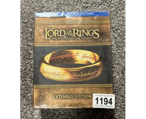 An blu-ray, unopened Lord of the rings extended edition trilogy