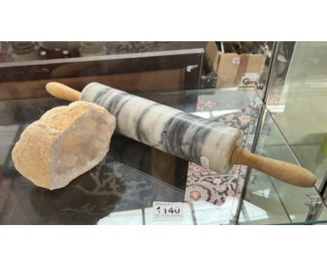 A quartz rock crystal cave &amp; a marble rolling pin