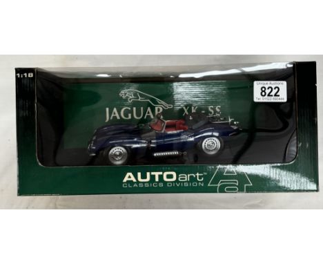 An Auto Art 1/18 Jaguar XK-SS in blue.