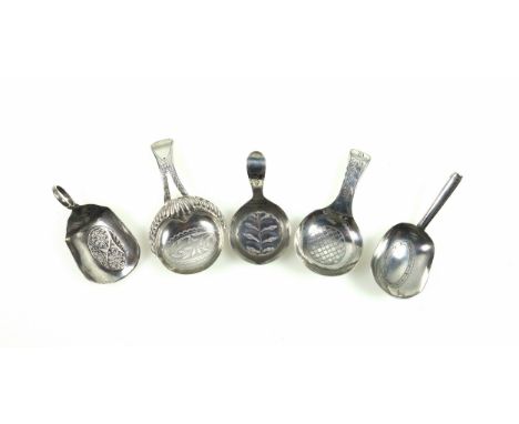 George III silver caddy spoon with a leaf engraved circular bowl and bright-cut handle, Birmingham, 1799, L.6.7cm, and 4 othe