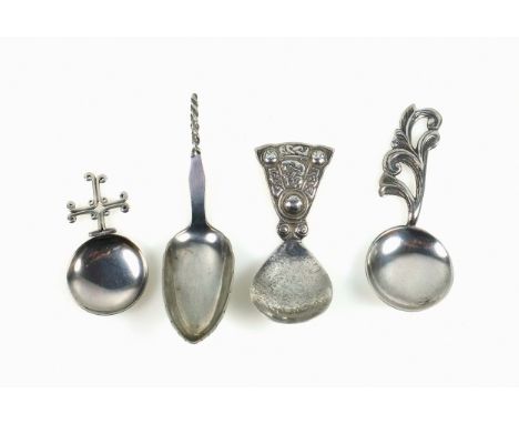 Scottish silver caddy spoon with a circular bowl and scroll cross handle, by S S, Edinburgh, 1967, L.6cm; Celtic spoon with a