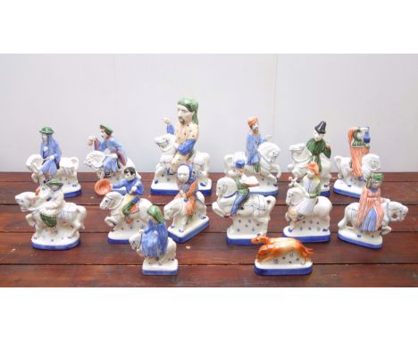 Collection of 13 Rye Pottery "Canterbury Tales" figures on horseback including Geoffrey Chaucer, H.31cm; The Merchant, H.24.5