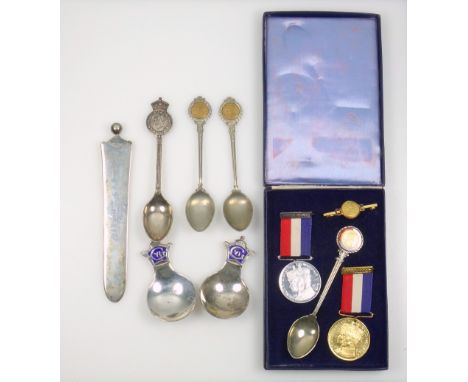 Pair of George VI silver commemorative Coronation caddy spoons, each with a blue enamelled terminal with cypher, crown, and d