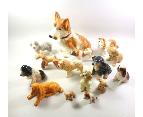 Large Sylvac model of a terrier, H28.5cm; and 14 smaller models of dogs. (15)
