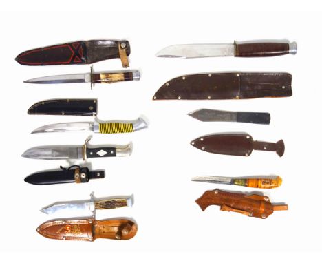 A Vintage Hunting Knife in Leather Sheath together with a Throwing Knife, the blade inscribed 'Truflite Throwing Knife', both
