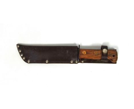 A British Army survival knife 1984, in a sheath dated 1988, blade length 18.2cm, serial number 1278214.